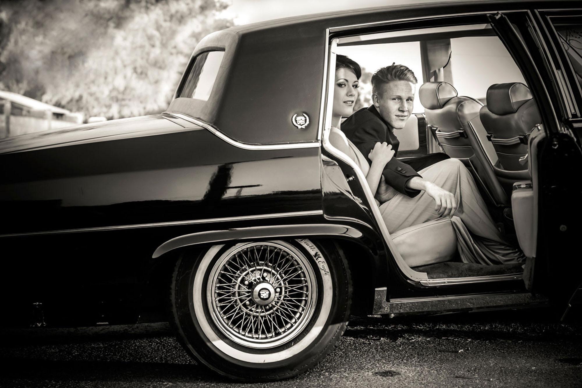bride and groom in a vintage car